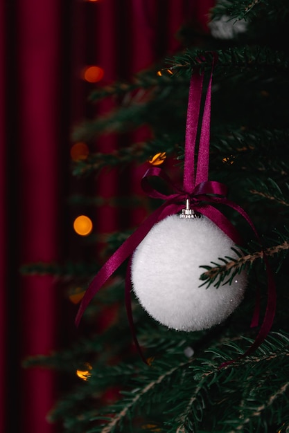 White christmas toy with red ribbon