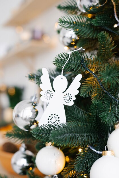 White Christmas toys on the Christmas tree close-up