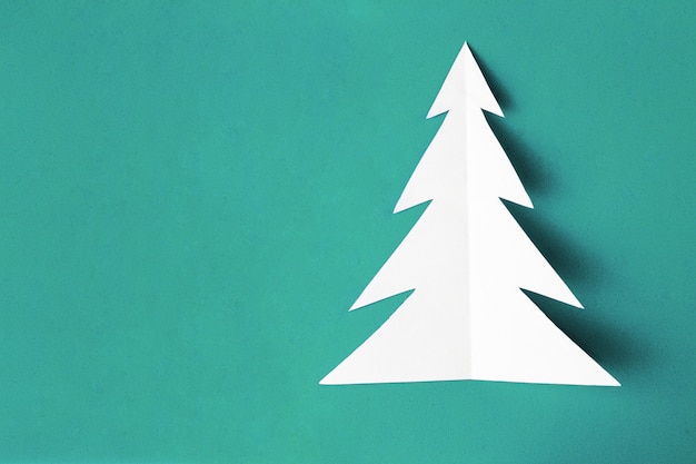 White christmas tree on blue background