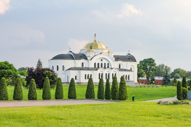 white church and green fields