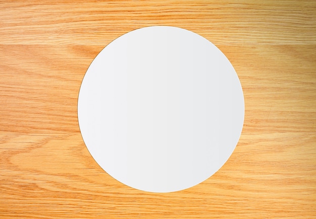 White circle paper on vintage brown wooden board