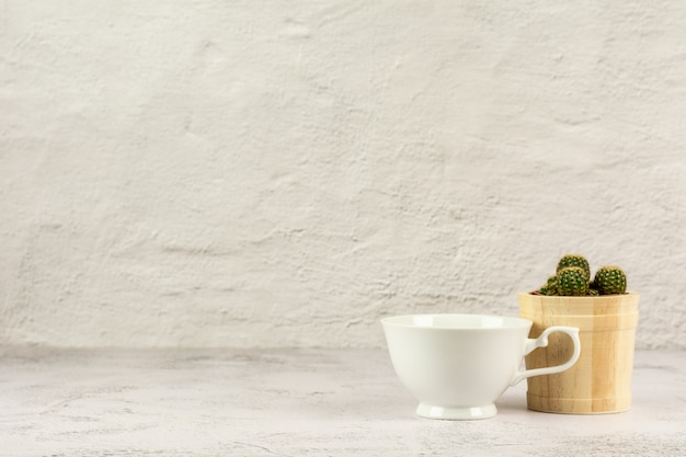 White classic coffee cup on white desk in the kitchen room.