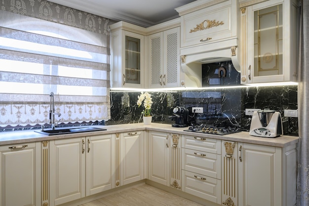 White classic cozy kitchen and dining room in city house