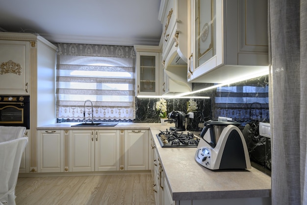 White classic cozy kitchen and dining room in city house