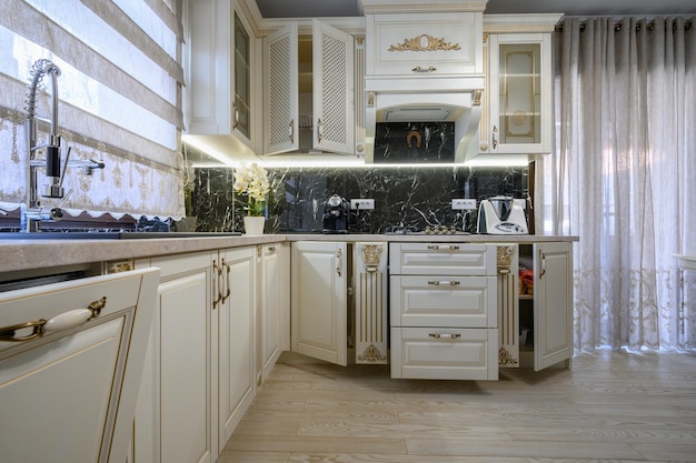 White classic cozy kitchen and dining room in city house