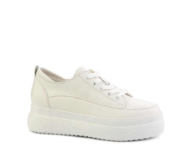 White classic leather trainers Casual women's style White lacing and white rubber soles Isolated closeup on white background