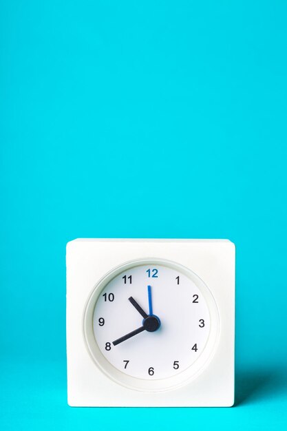 White clock on a blue background