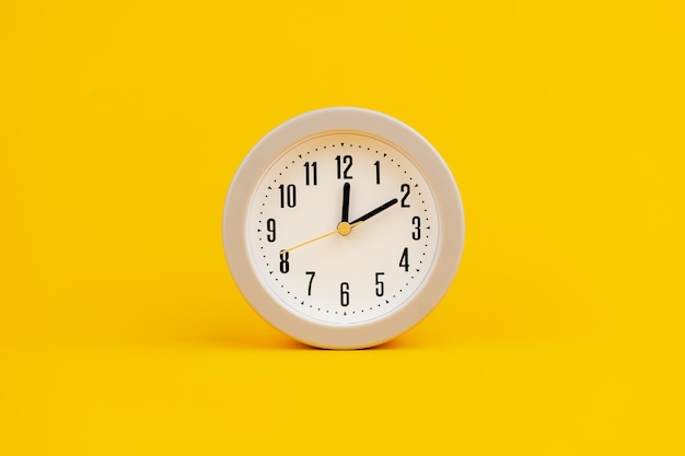 White clock on yellow background concept of time time is important to work