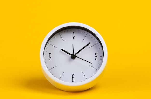 White clock on yellow studio