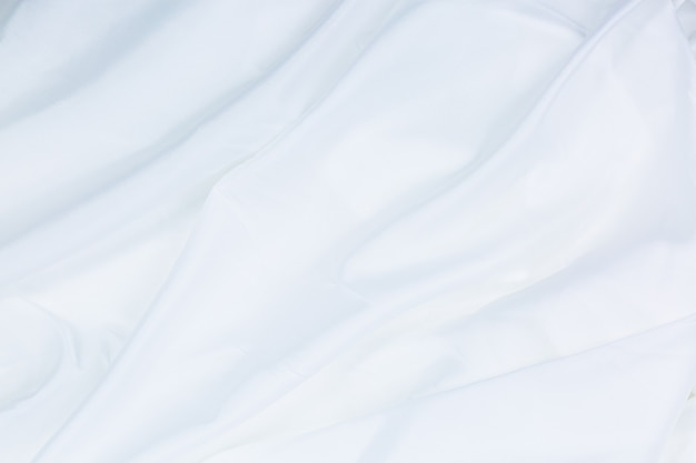 White cloth background abstract with soft wavesCloseup elegant crumpled of white