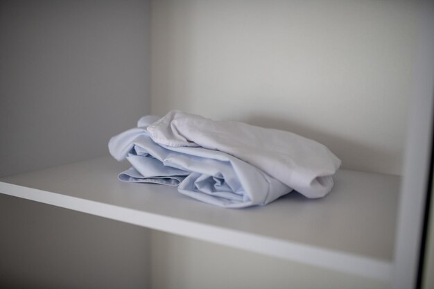 White clothes drying on bed at home