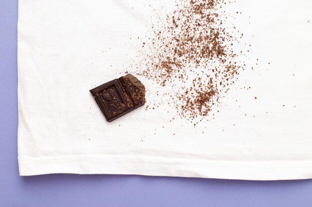 White clothes with ditry stains from chocolate on purple very peri background