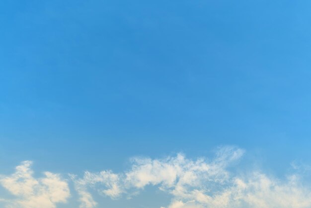 White cloud and blue sky background with copy space