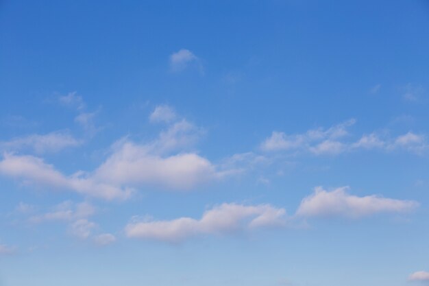 white clouds against a blue March sky sunny day