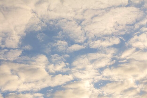 White clouds on the background of the blue sky