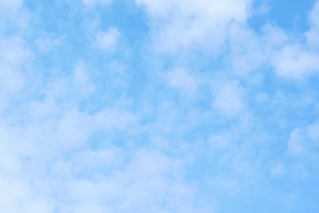 White clouds in the blue sky as a background.