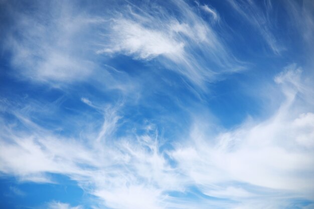 White clouds in the blue sky at noon summer