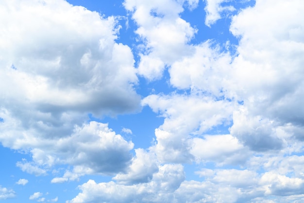 White clouds in a bright blue sky. The beauty of the nature.