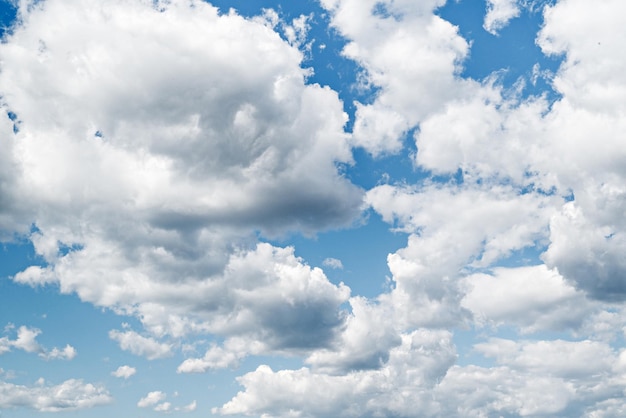 White clouds in a bright blue sky. The beauty of the nature.