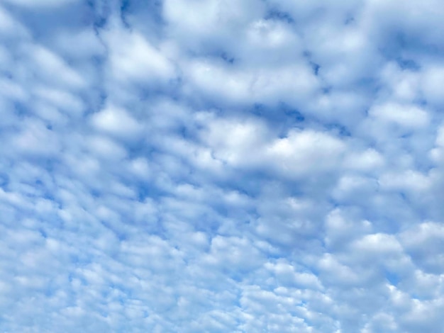 White cloudscape on blue sky background