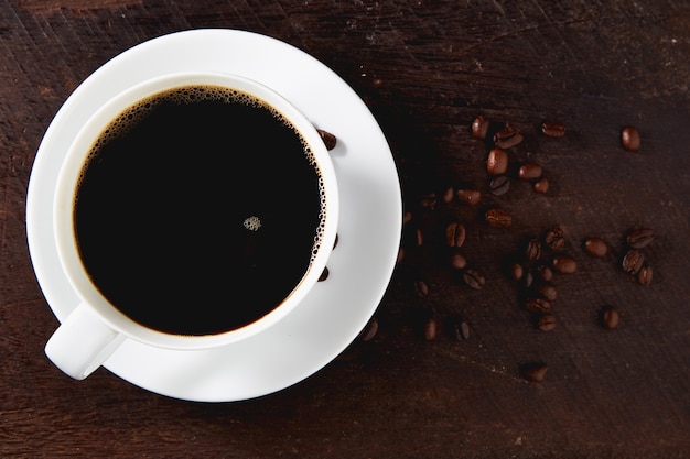 White coffee cup and beans