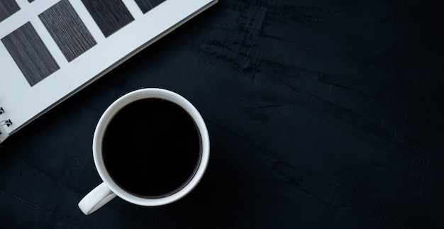 White coffee cup on black table