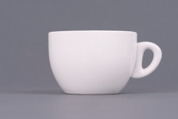 White coffee cup on gray background