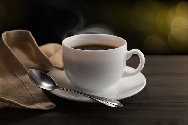 A cup of coffee next to a pair of glasses photo – Free Italy Image