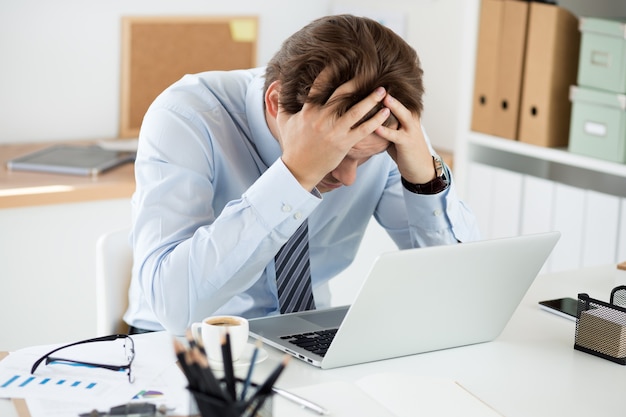 white collar worker hold hand in hands at workplace in office. data corruption or computer virus, technical problem, human factor, creative stupor, language study, education and exam concept