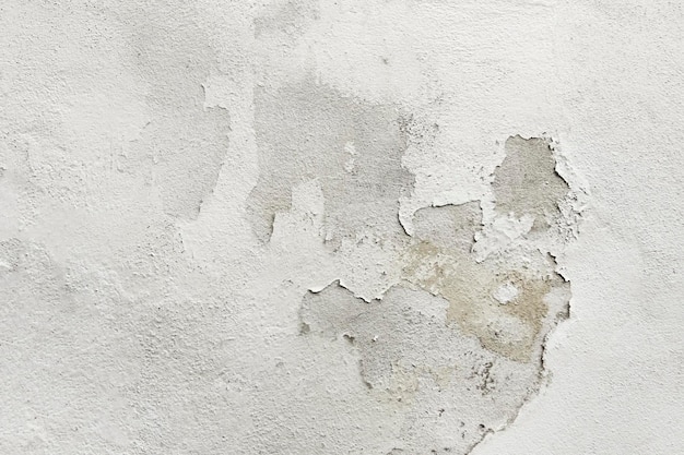 White concrete surface with a shabby plaster
