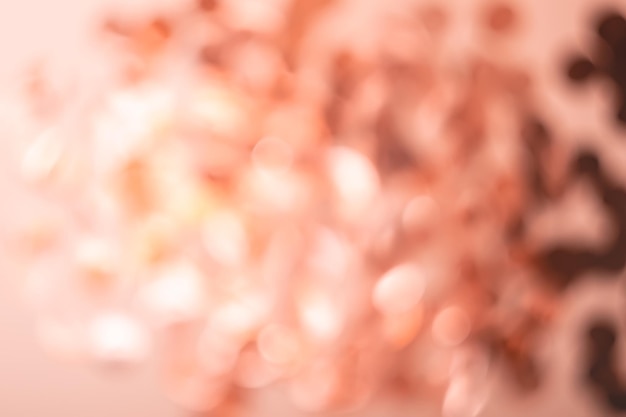 White and coral brown bokeh lights. Abstract blurred background.