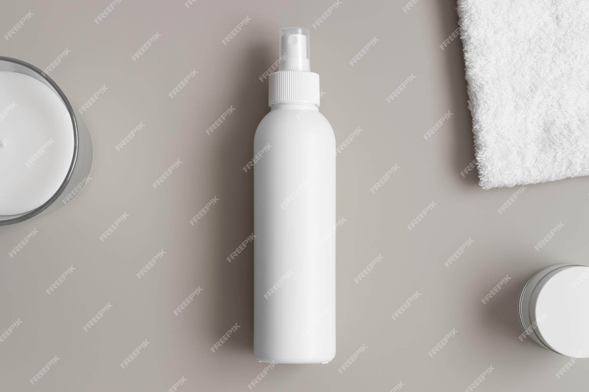 https://img.freepik.com/premium-photo/white-cosmetic-spray-bottle-mockup-with-towel-beige-table_721474-2399.jpg?w=2000