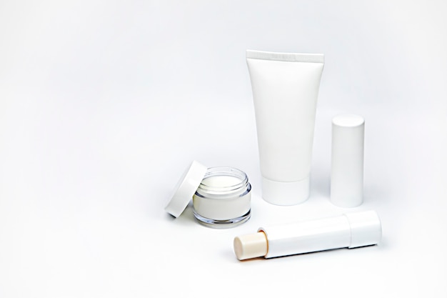 white cosmetics on light background