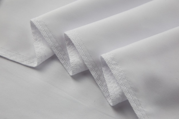 white cotton fabric with a processed cut covering seam