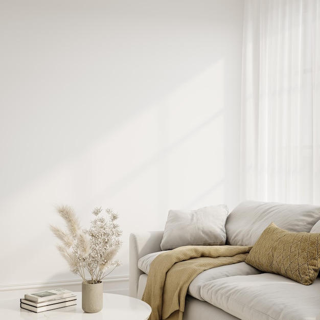 a white couch with a vase of flowers on it and a book on the table