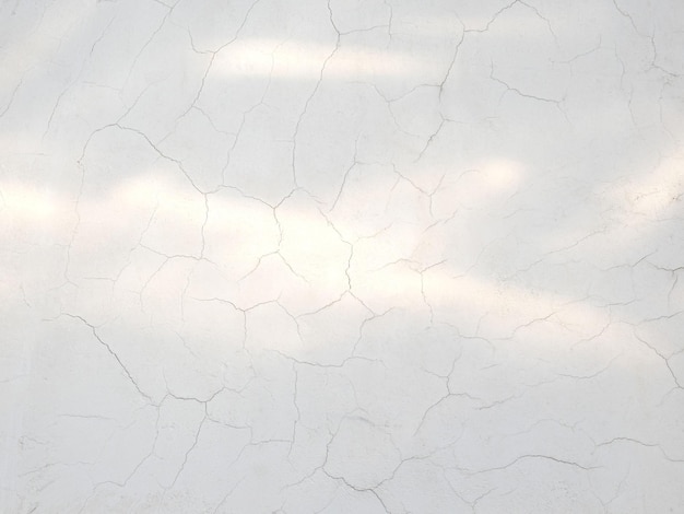 White cracked cement light surface wall background