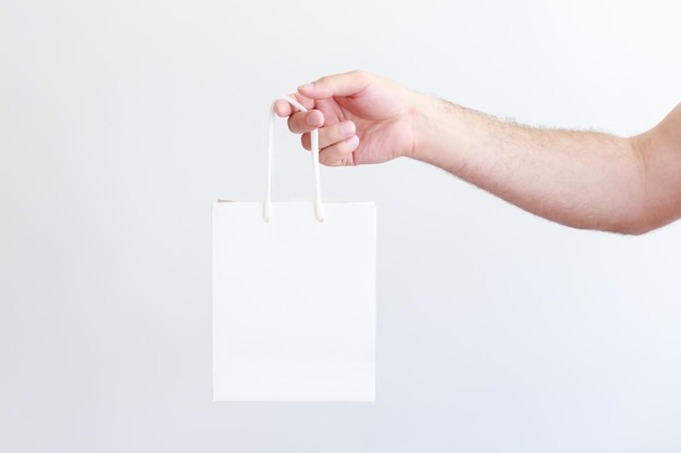 White craft bag for logo in male hand