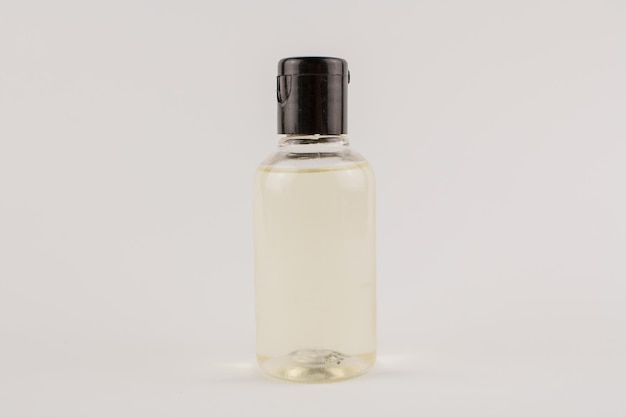 Photo white cream in a transparent jar on a white background