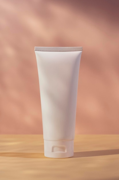 White cream tube mockup isolated on pink background cosmetics mock up