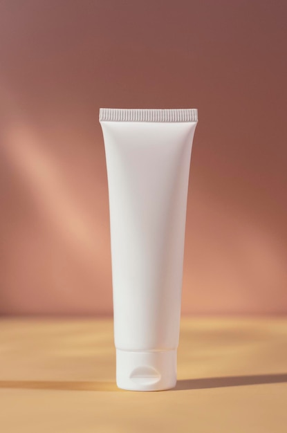white cream tube mockup isolated on pink blurred background cosmetics mock up skin care