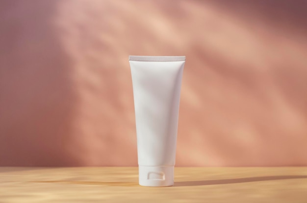 White cream tube mockup isolated on pink blurred background cosmetics mock up