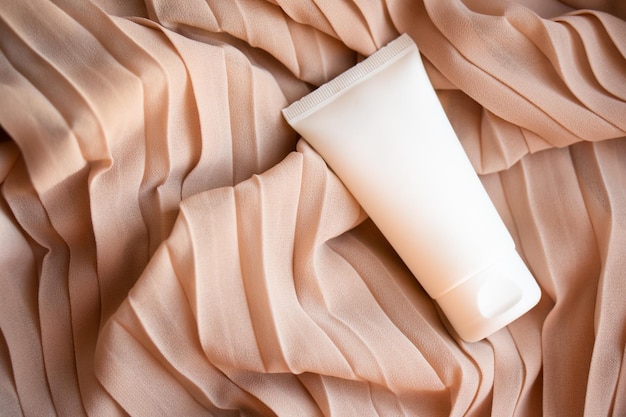 White cream tube mockup on textile background