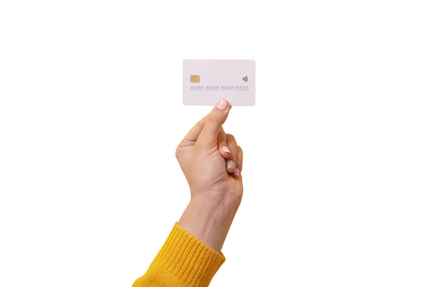 White credit card in female hand card with electronic chip isolated on white background