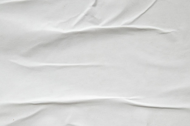 White crumpled and creased paper poster texture background