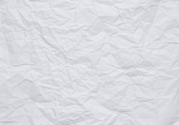 Photo white crumpled paper background with texture