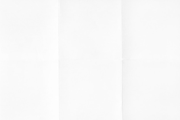 White crumpled unfolded paper sheet texture background Paper folded in six Full frame