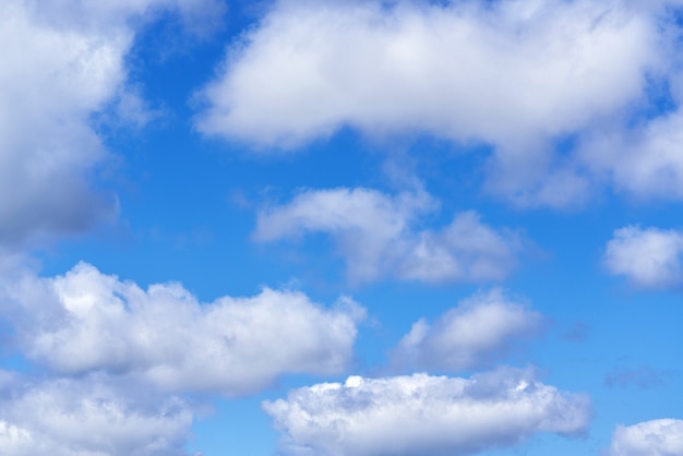 White cumulus clouds on blue sky background, natural phenomenon background and texture