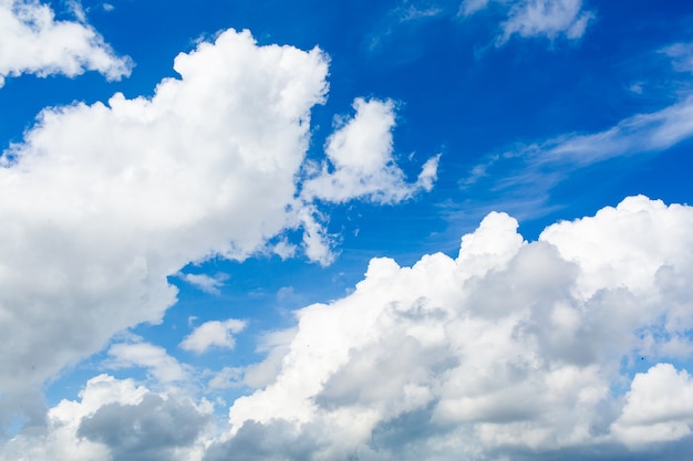 White cumulus clouds and a blue sky