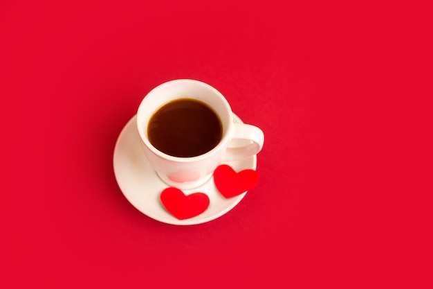 Photo white cup of coffee with hearts