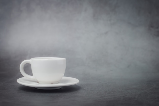 White cup of coffee with saucer with copy space